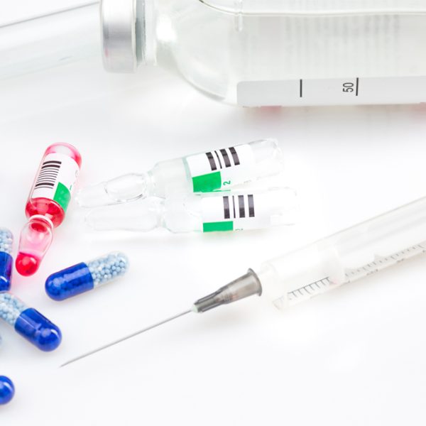 Blue capsules and pills background