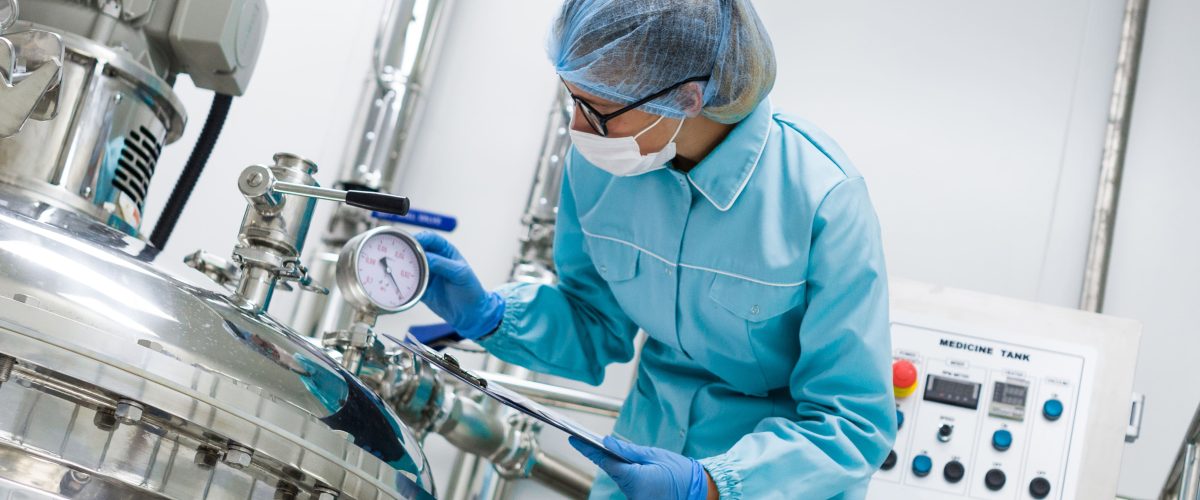 bended-scientist-blue-lab-uniform-check-how-compressor-tank-works-tablet-hands-close